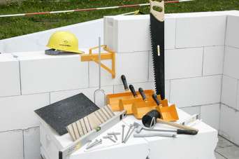 Как выбрать клей для строительства дома из блоков